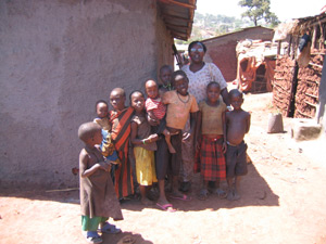 Project worker Rosemary with children from the slum