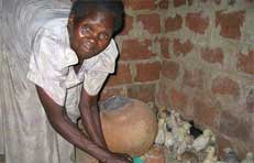 Picture of a woman feeding chicks